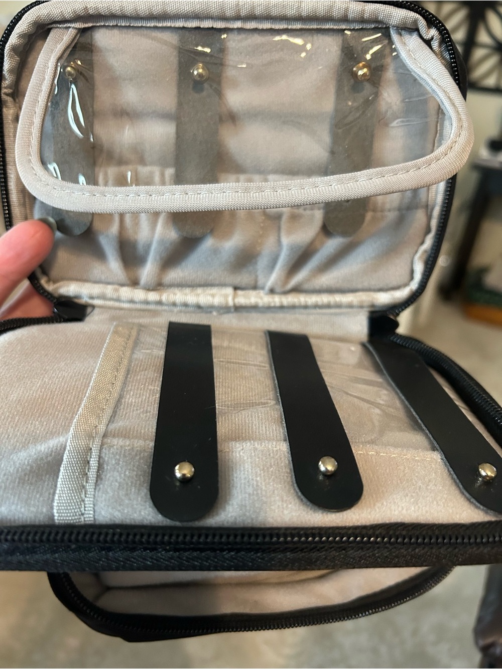 Small travel jewelry bag with compartments.